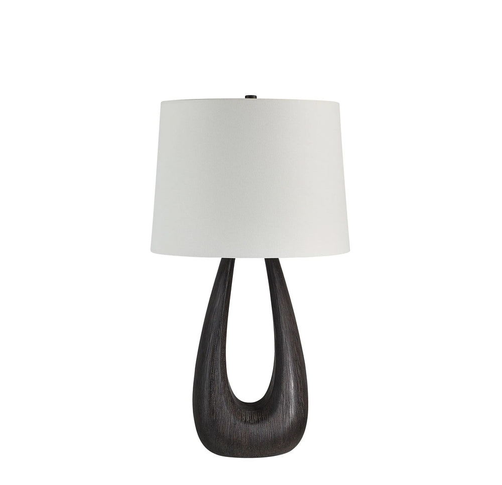 Table lamp with a dark wooden base and white lampshade on a white background