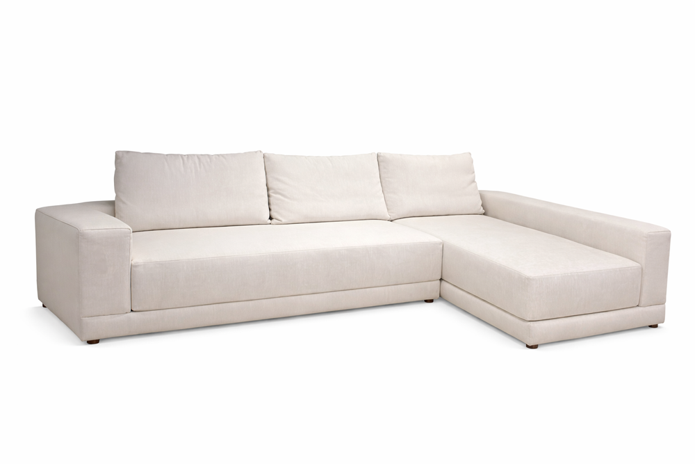 Beige sectional sofa on a white background