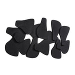 A collection of black, irregularly shaped biscuit accent wall decor pieces