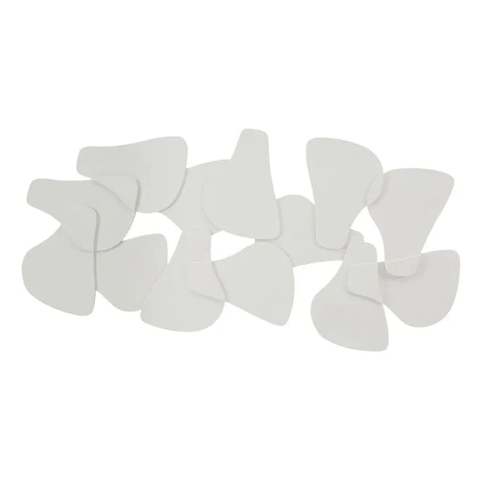 A collection of white, biscuit-shaped MDF wall accents arranged in a decorative pattern.
