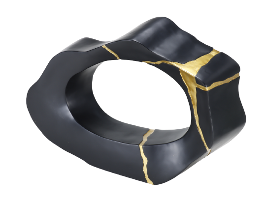 A black and gold decorative statue with a smooth finish and geometric shape.