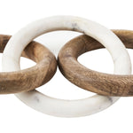 Two interlocking wooden rings with white marble-like centers on a white background