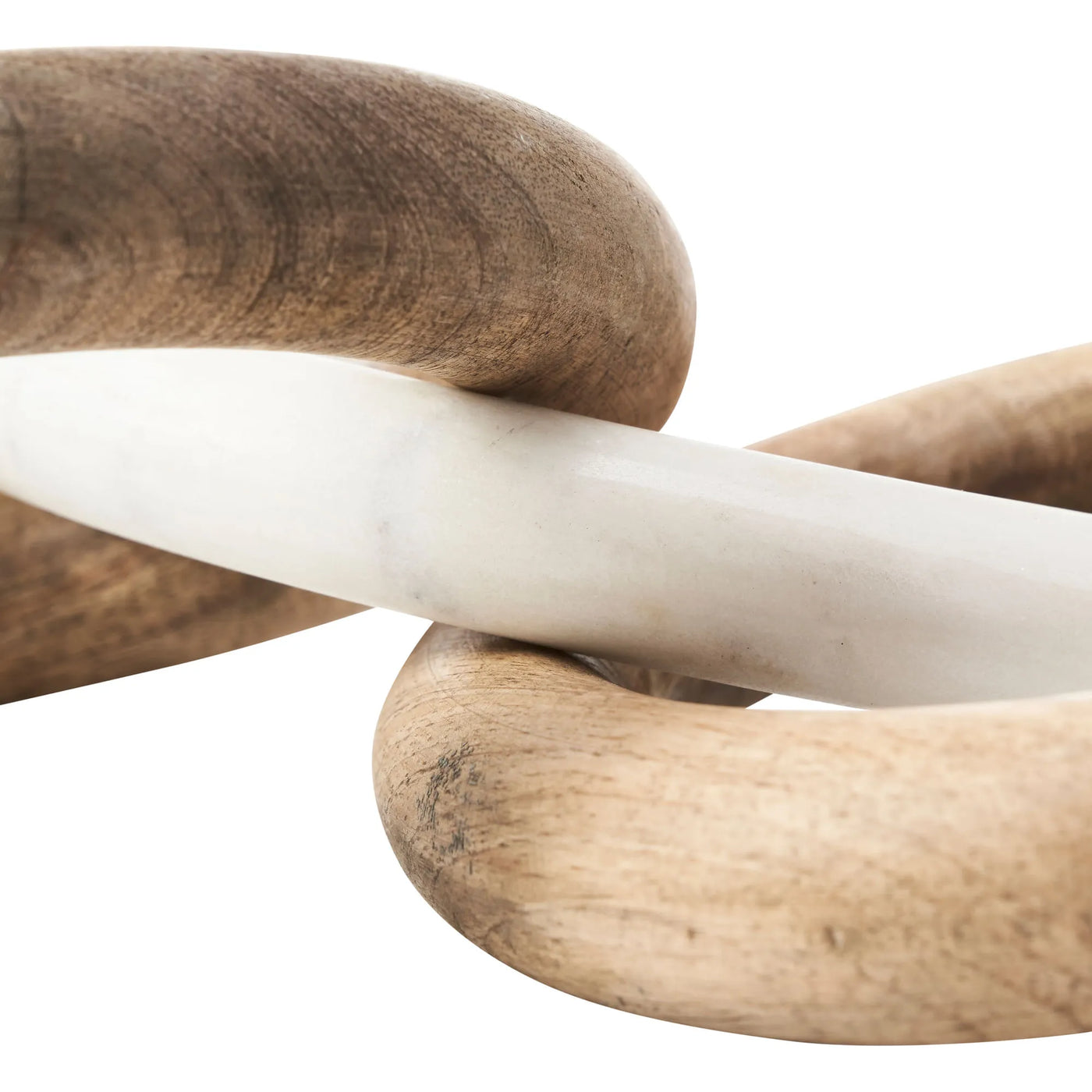 Three wooden rings of different colors intertwined on a white background