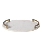 A round white marble tray with a brass handle.
