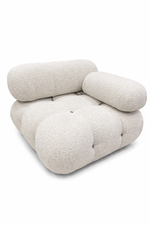 Modern beige lounge chair on a white background