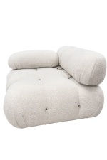 White upholstered chair with a rounded design on a white background