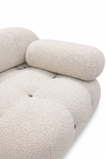 Close-up of a textured beige sofa on a white background