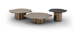 Three modern coffee tables with unique designs on a white background