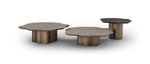 Three bronze coffee tables of different shapes on a white background