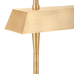 Close-up of a modern linear pendant light fixture with a brushed brass finish, showing the shade, downrod, and part of the hanging stem against a white background.