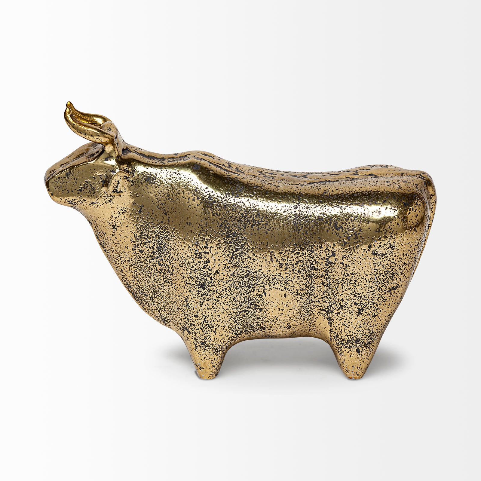 A decorative brass bull figurine with a rustic-gold polish finish.