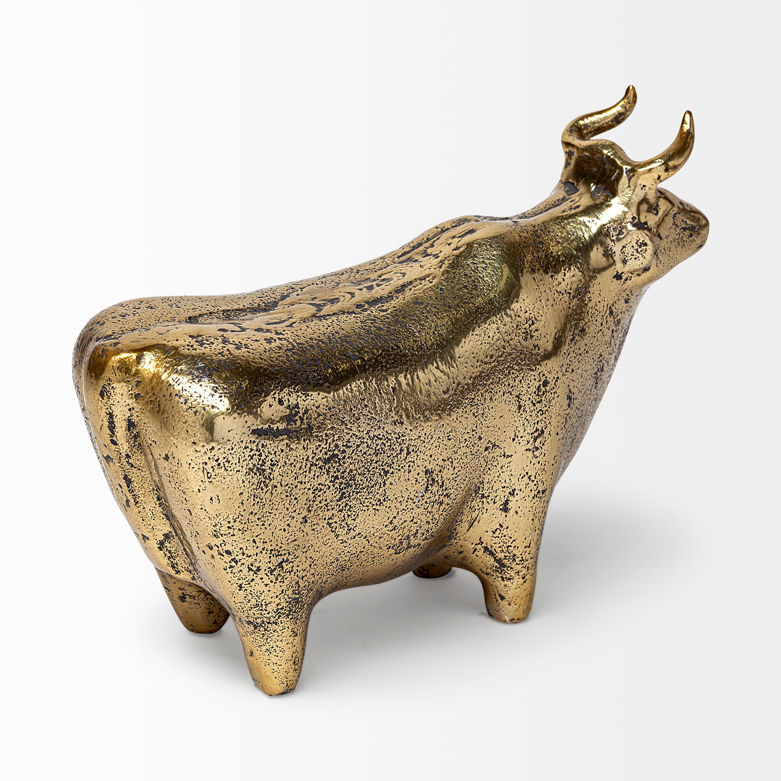 A decorative brass bull figurine with a rustic-gold polish finish.