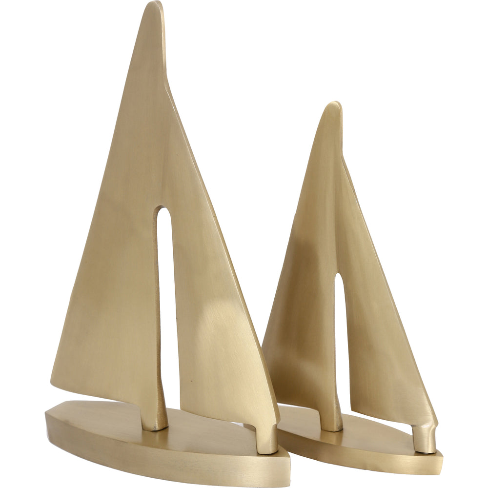 Gold plated brass sailboat decorative object with a sleek finish, depicting a two-masted sailboat in a three-quarter view.