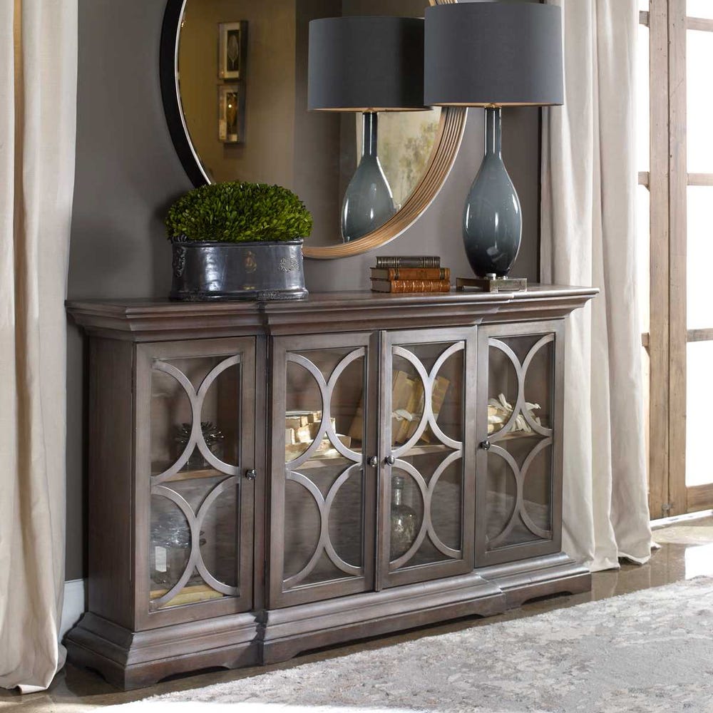Decorative sideboard with glass doors in a room setting