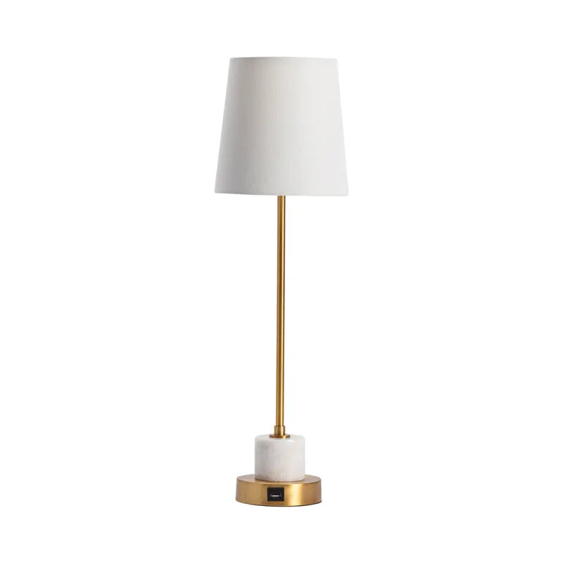A brass marble table lamp with a white shade, gold metal stem, and a white marble base.