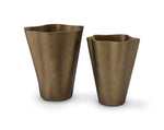 Two bronze-colored planters on a white background