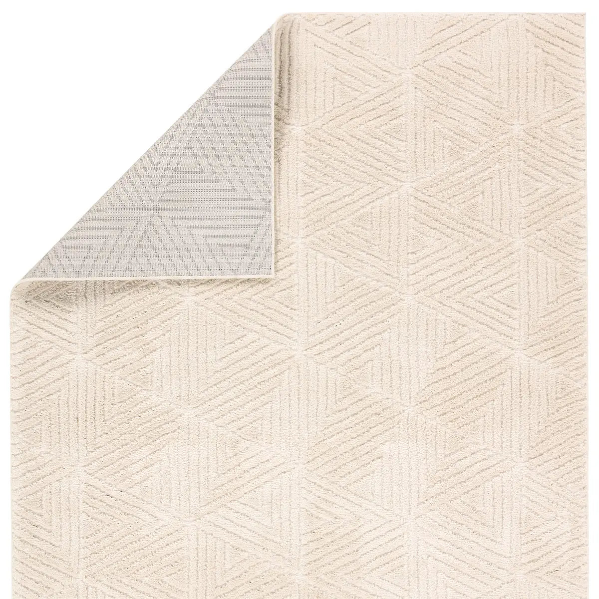 Close-up of a textured beige rug with geometric pattern