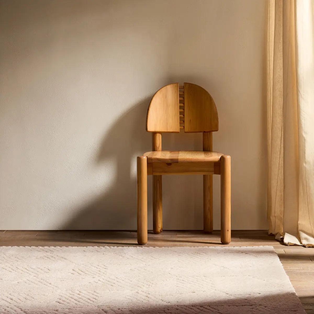 Wooden chair in a room with a neutral color palette