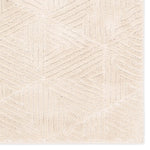 Close-up of a textured beige fabric with a subtle pattern