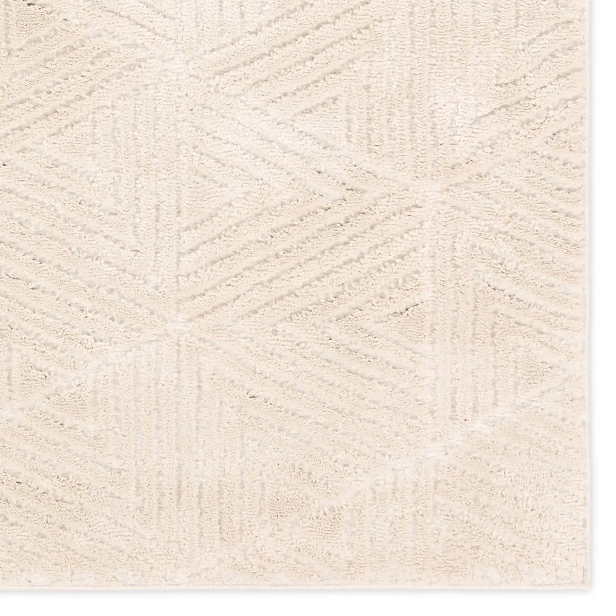 Close-up of a textured beige fabric with a subtle pattern