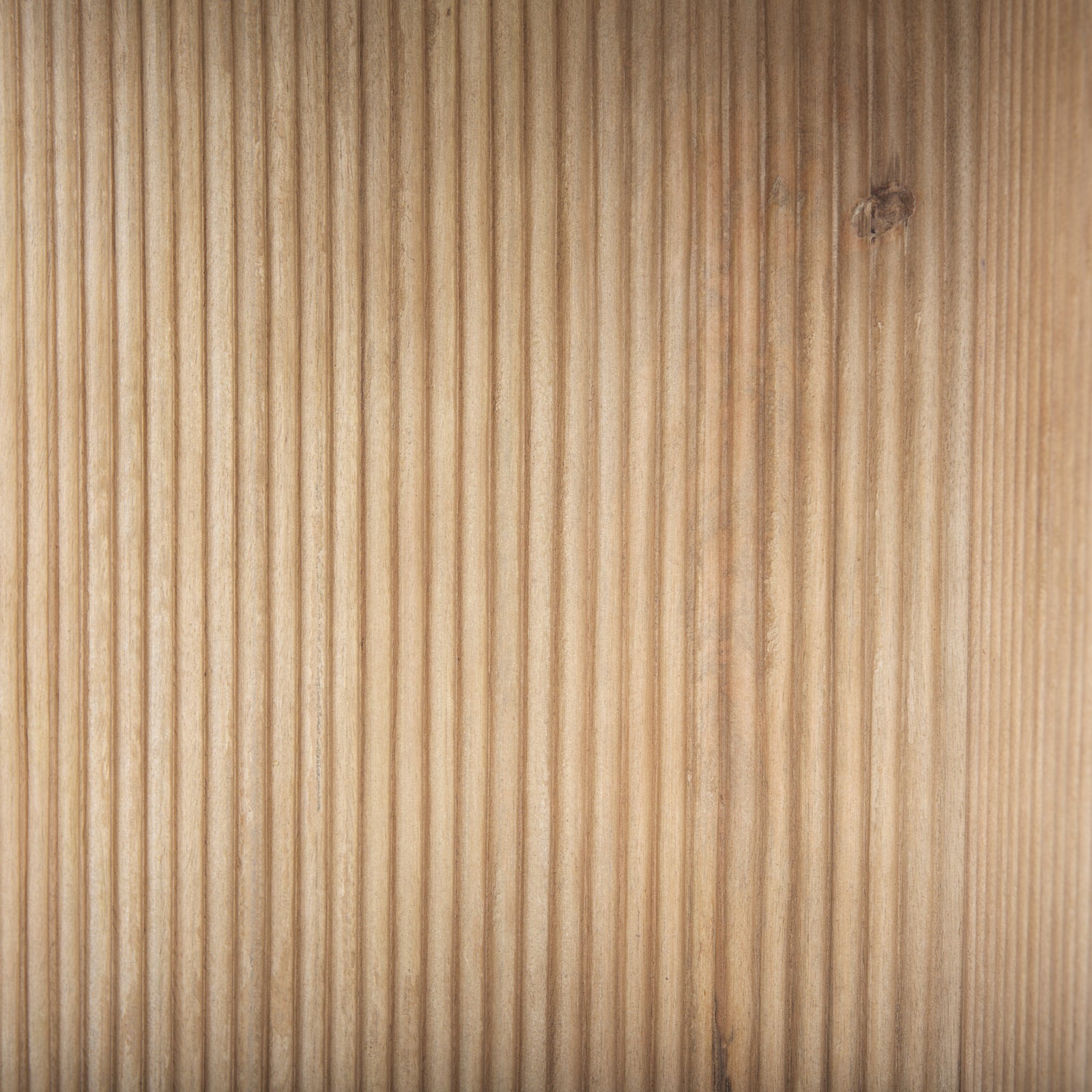 Round white marble tabletop with a wooden base featuring a geometric pattern, likely a side table.