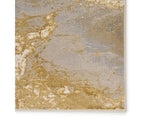 A power loomed area rug with a gold color pattern