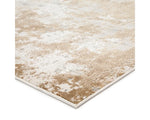 A power loomed area rug with a distressed texture design in beige and brown tones.