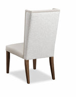 Chair with a textured backrest and wooden legs on a white background