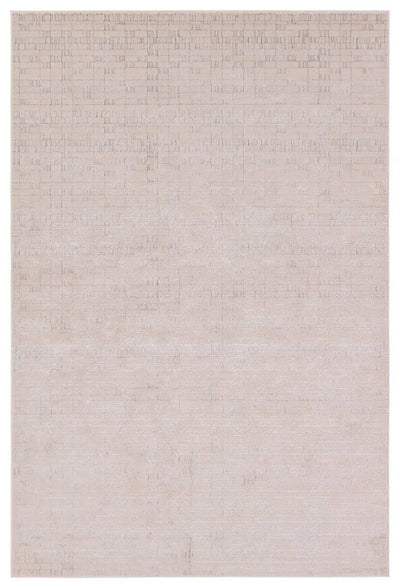 A beige area rug with a textured surface, power loomed construction, and a visible brand tag.