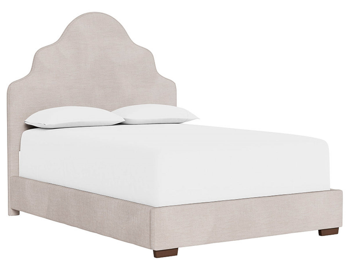 Beige upholstered bed with white mattress and pillows on a white background