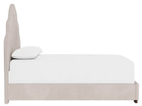Beige upholstered bed with white bedding on a white background