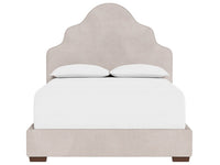 Beige upholstered bed with white bedding on a white background
