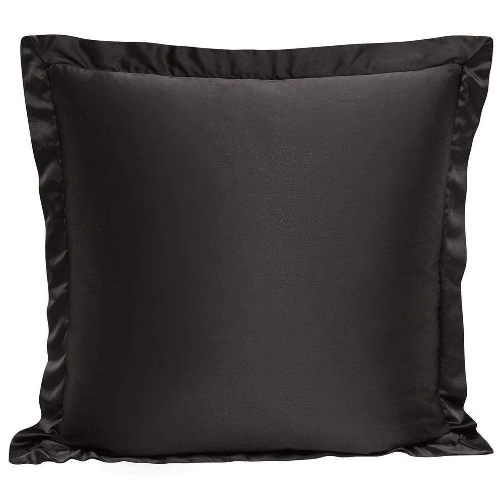 Black satin pillow on a white background