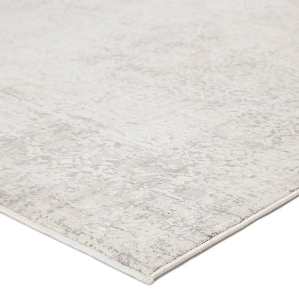 Close-up of a textured gray rug on a white background
