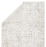 Textured rug with a subtle pattern on a white background