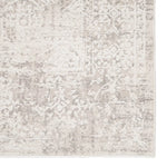 Textured area rug with a neutral color palette on a white background