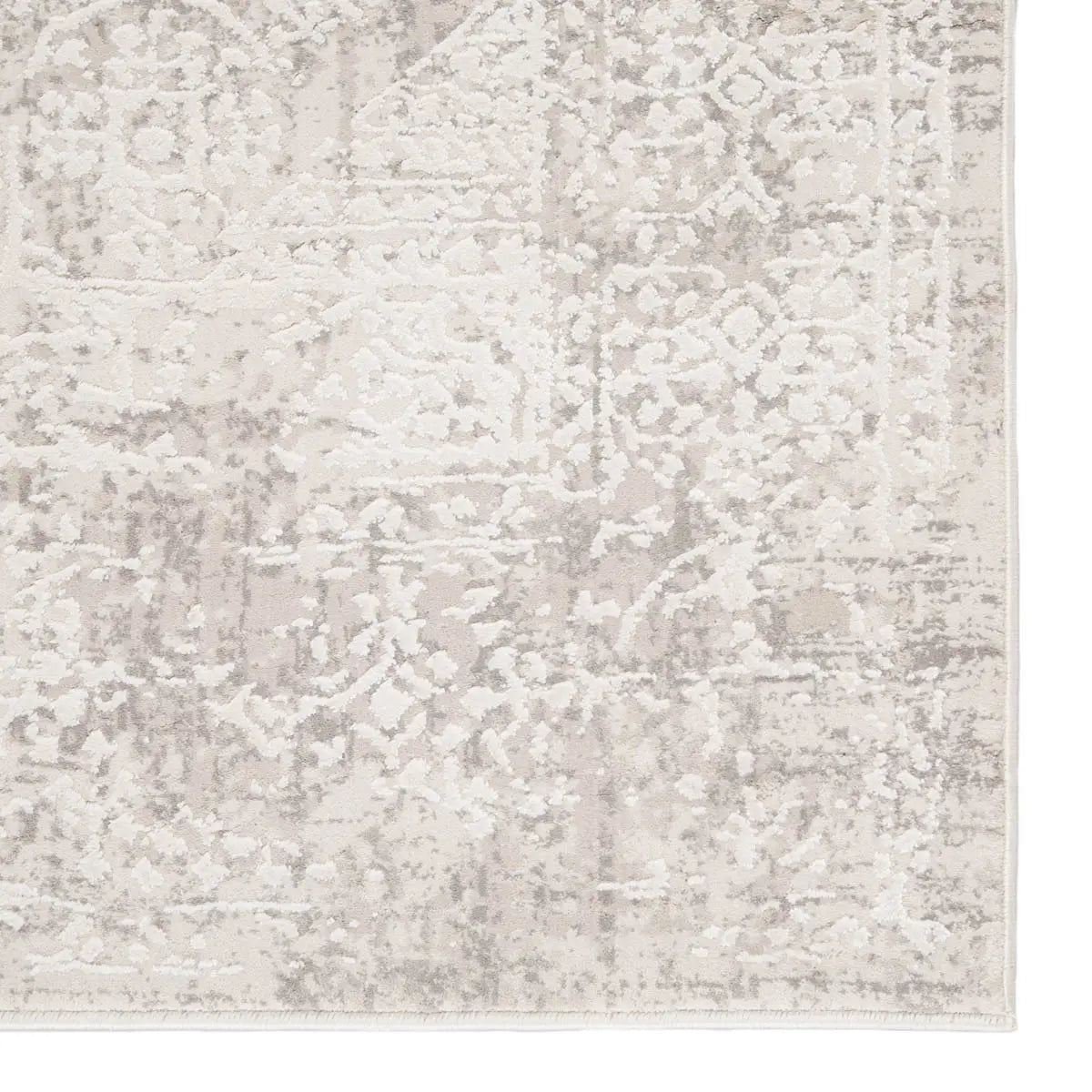 Textured area rug with a neutral color palette on a white background