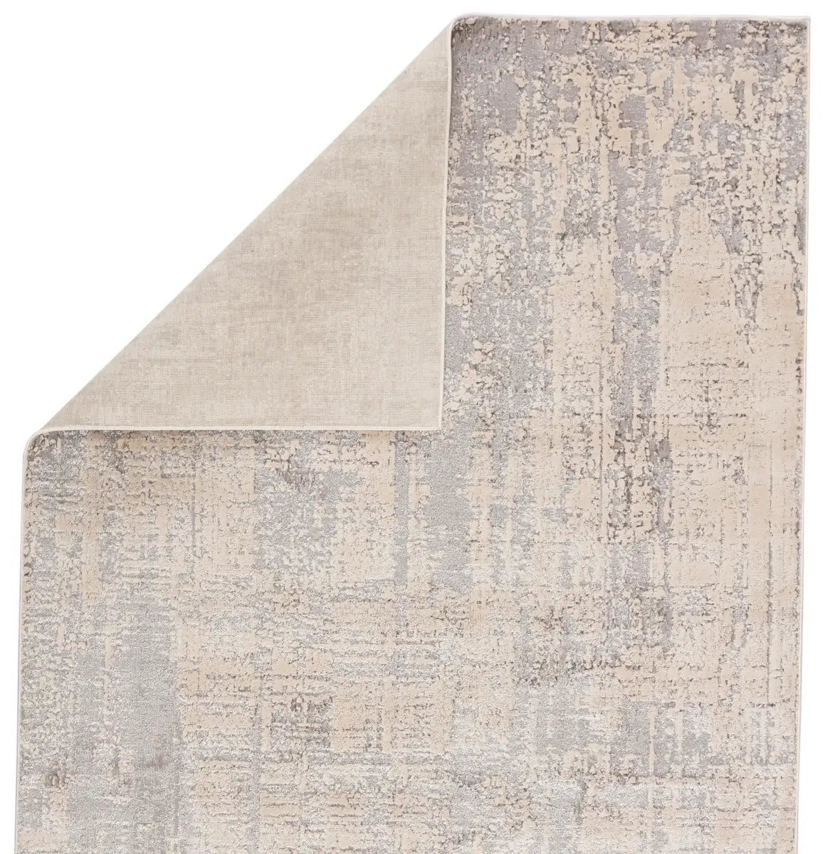 Textured area rug with a neutral color palette on a white background
