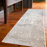 Gray patterned rug on a wooden floor