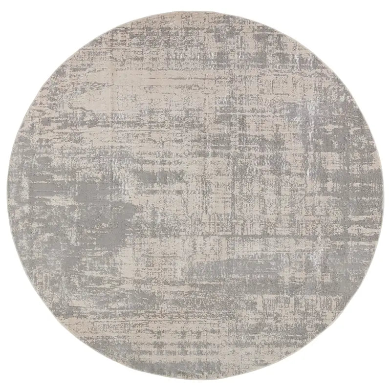 Round gray and beige rug on a white background