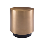 Gold cylindrical side table with black base on a white background