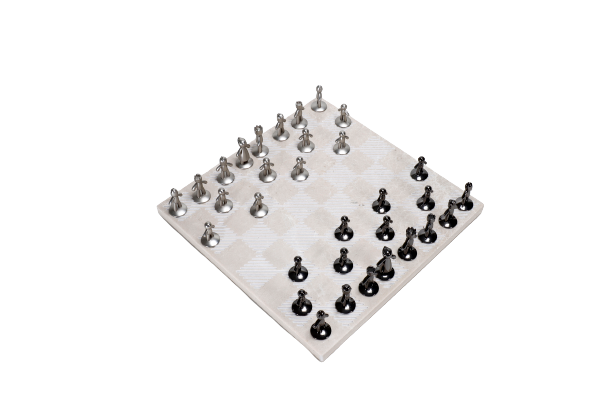 A beige marble chess board set with white and black pieces arranged on the board.