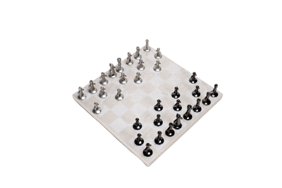 A beige marble chess board set with white and black pieces arranged on the board.