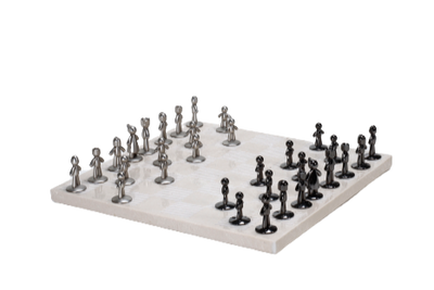 A beige marble chess board set with white and black pieces arranged on the board.