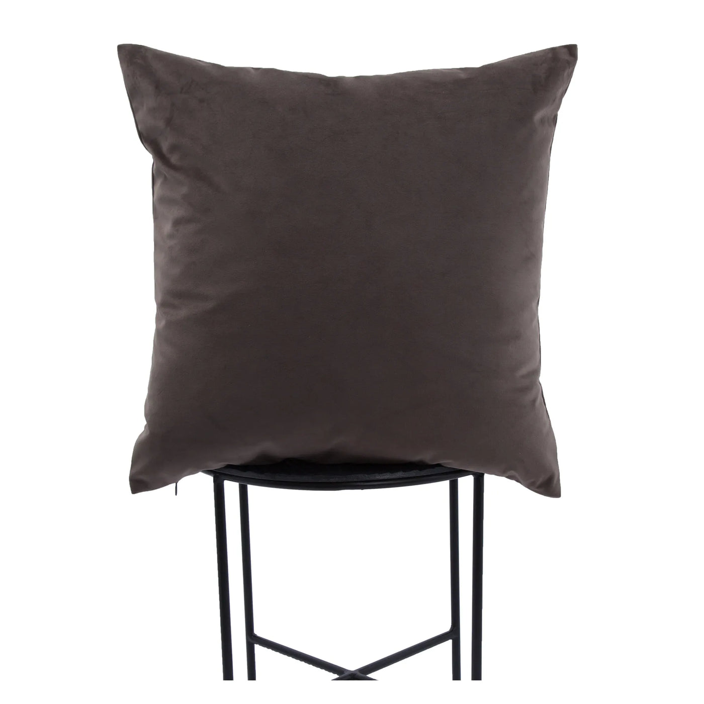 Dark brown pillow on a black stool against a white background