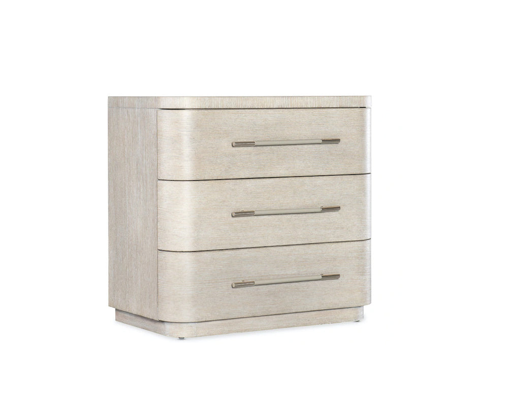 Beige three-drawer dresser with metallic handles on a white background
