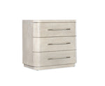 Beige three-drawer dresser with metallic handles on a white background