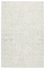 A plain gray area rug with no visible patterns or textures.