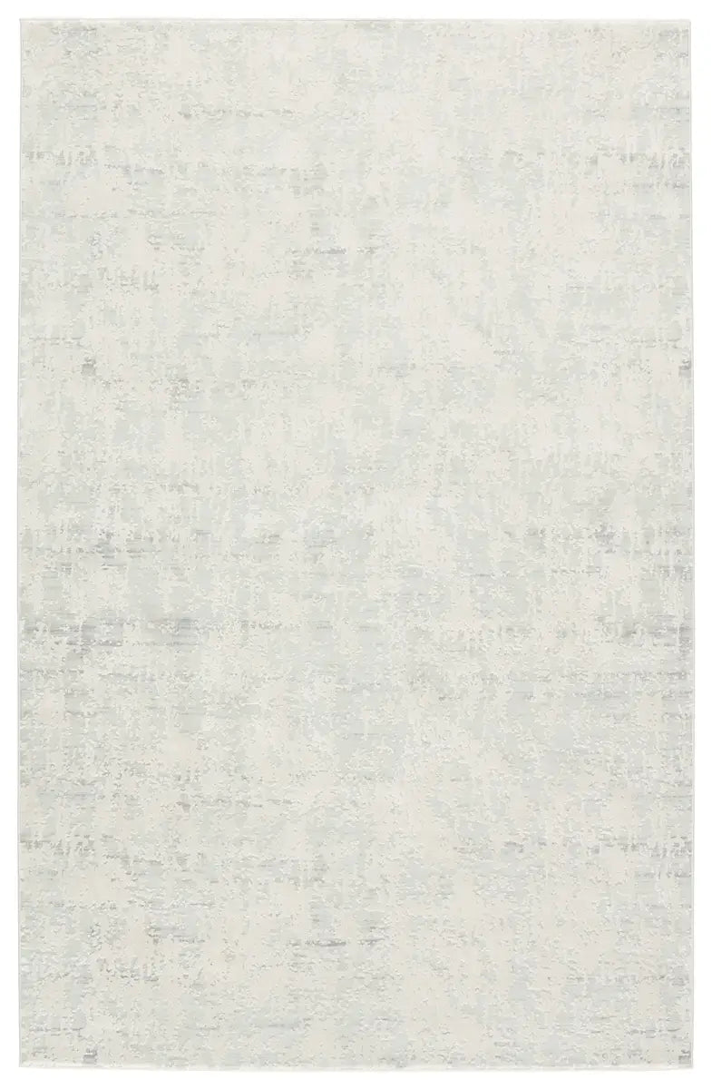 A plain gray area rug with no visible patterns or textures.