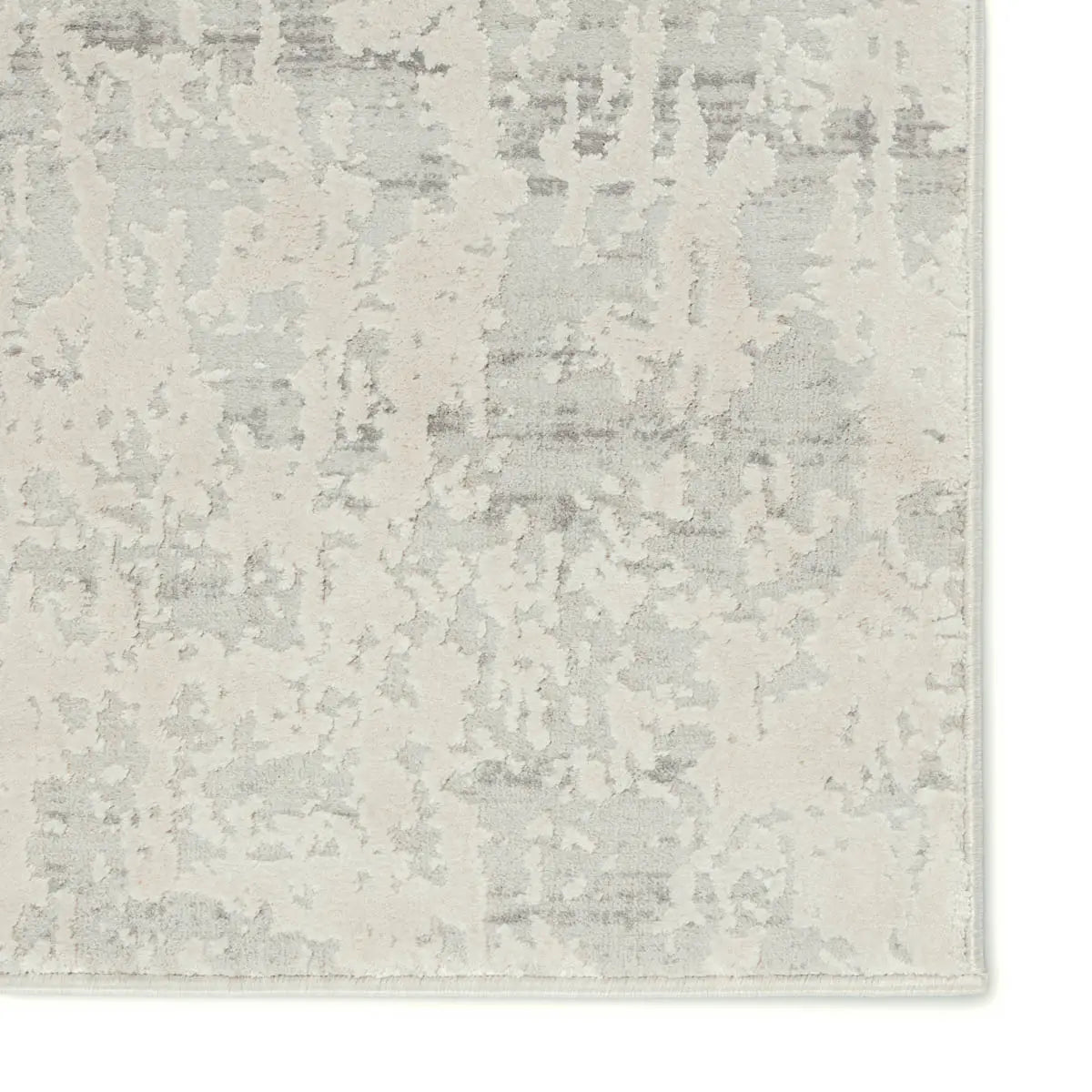 A plain gray area rug with no visible patterns or textures.